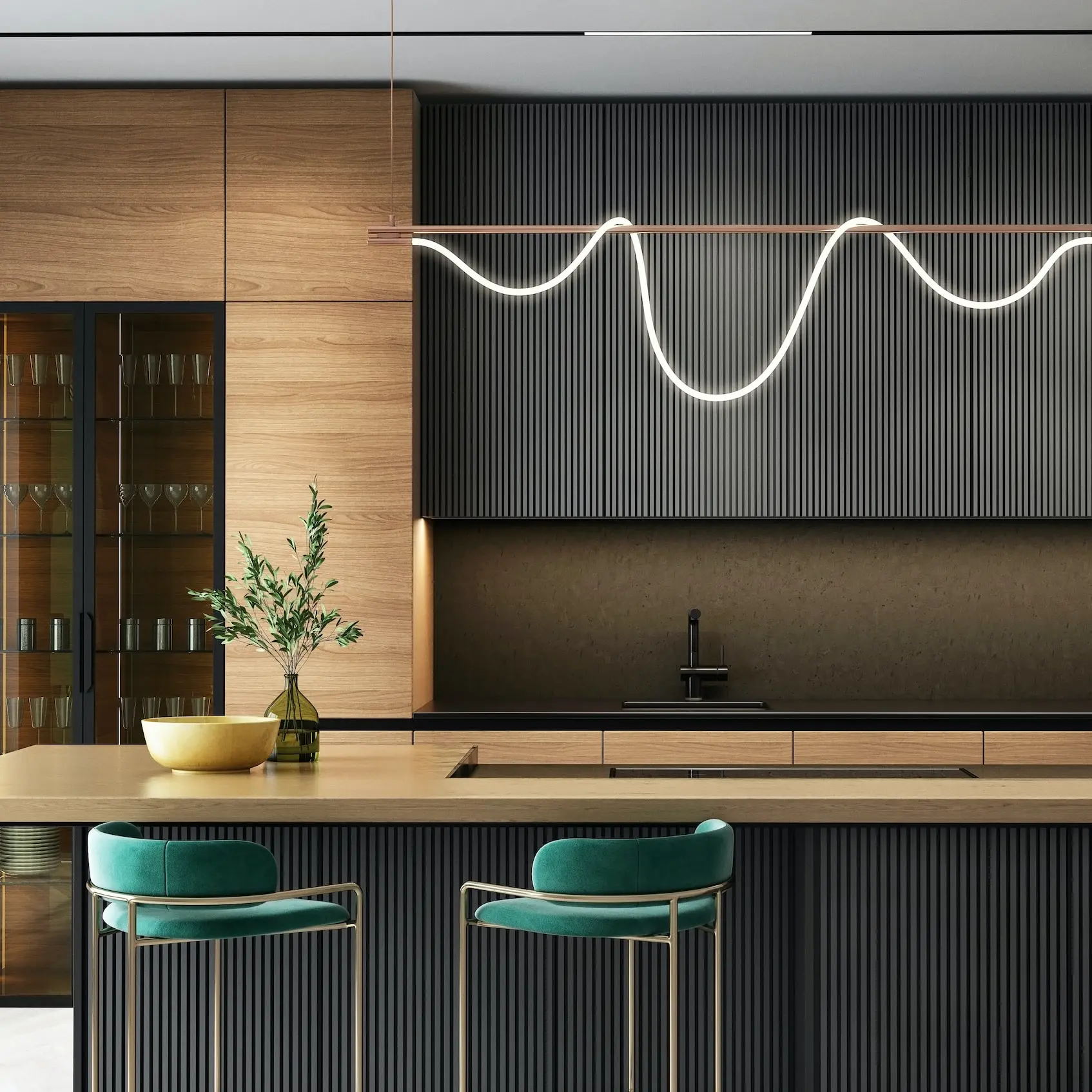 a modern kitchen with a bar and stools
